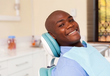 Smiling man in dental chair