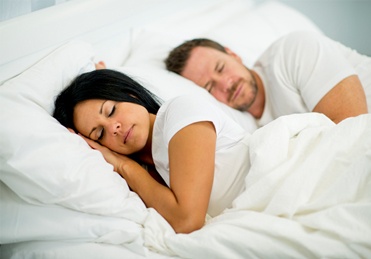 Man and woman sleeping soundly