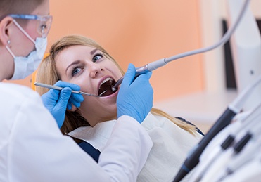 Woman receiving dental treatment