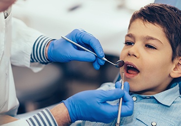 Child receiving dental treatment