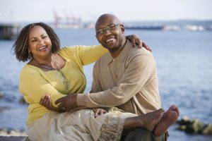 middle aged couple embracing on the beach