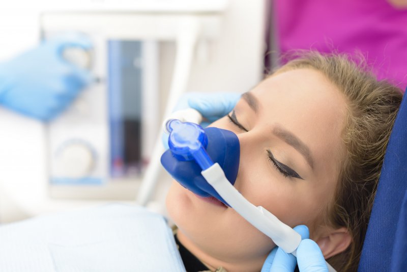 woman sleeping receiving sedation dentistry